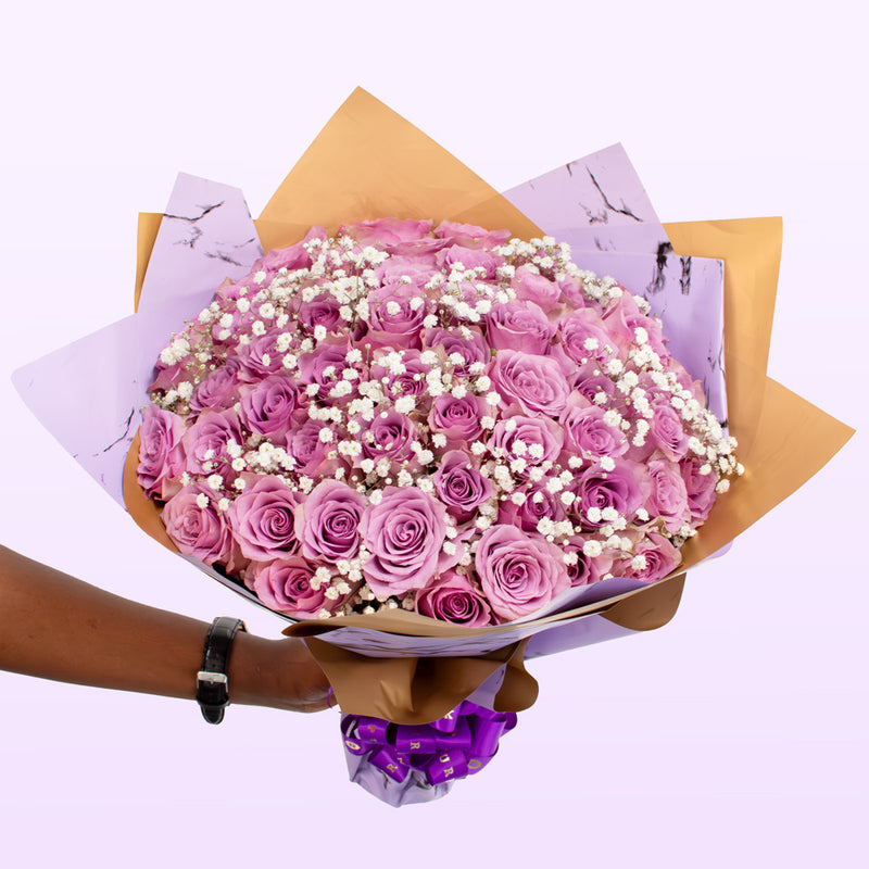 The Purple Roses & White Baby Breath Bouquet